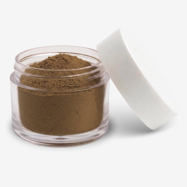 A small clear plastic jar filled with brown food colouring powder, shown with a white lid leaning against it on a clean white background.