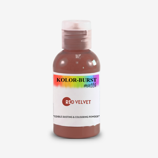 A bottle of Kolor-Burst Matts Red Velvet edible dusting and colouring powder, featuring a white label with a rainbow accent and a clear cap, set against a plain light gray background.